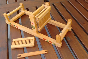 Toy mini loom with painted flower decoration